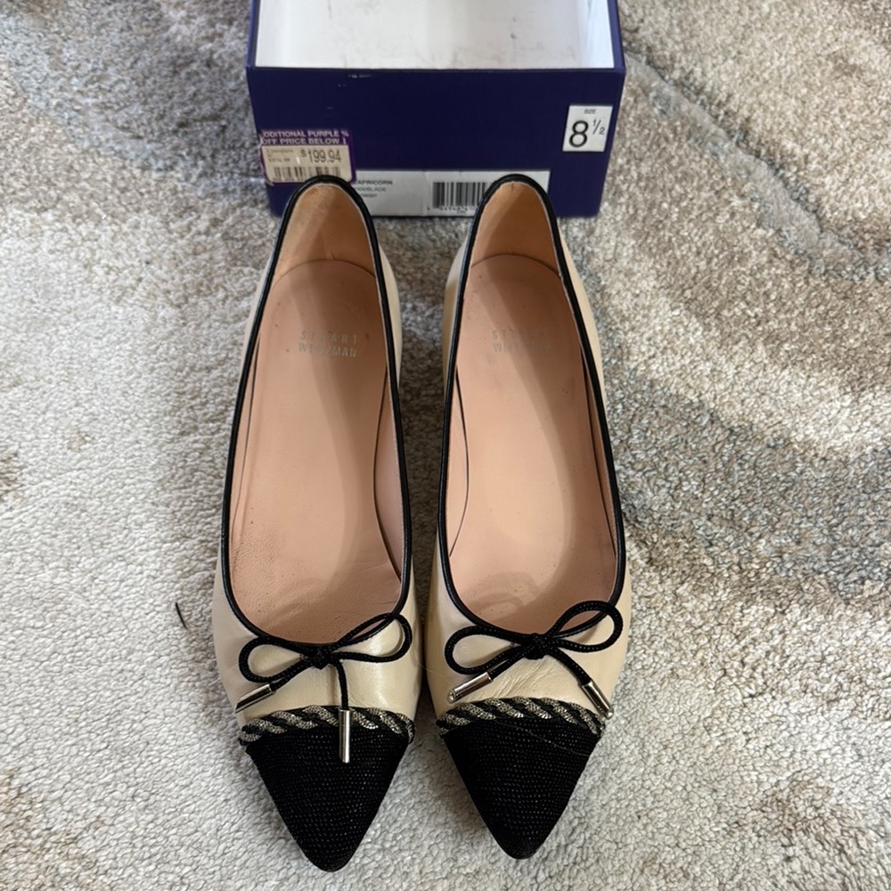 Stuart Weitzman Black and Cream Flats with Elegant Bow